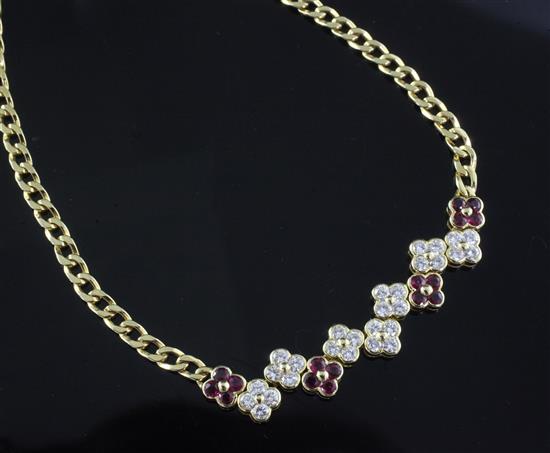 A Garrard & Co 18ct yellow gold curb-link necklace with seven diamond and four ruby conjoined four-stone flowerhead clusters,